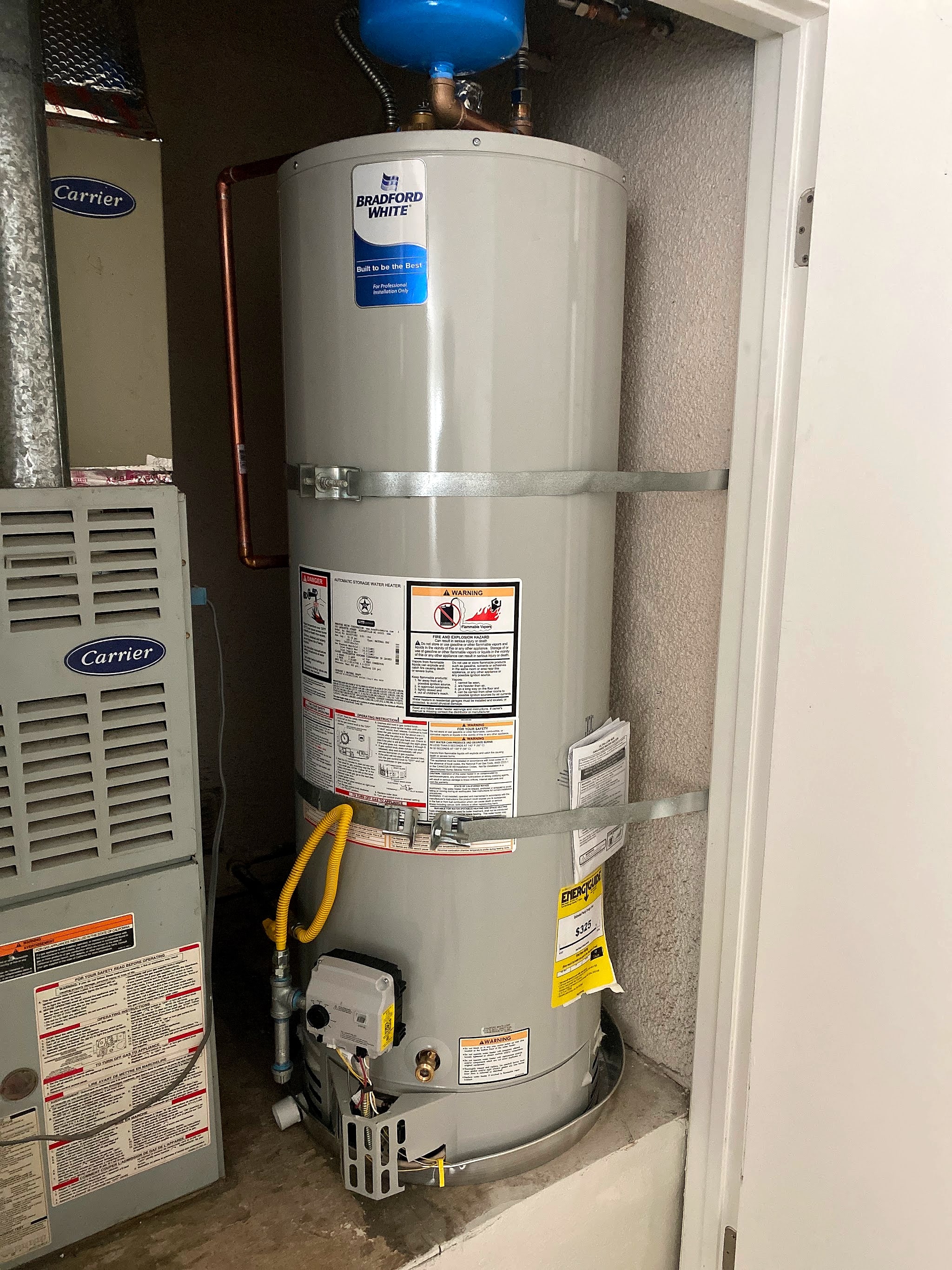 New Bradford White gas water heater installed next to the furnace